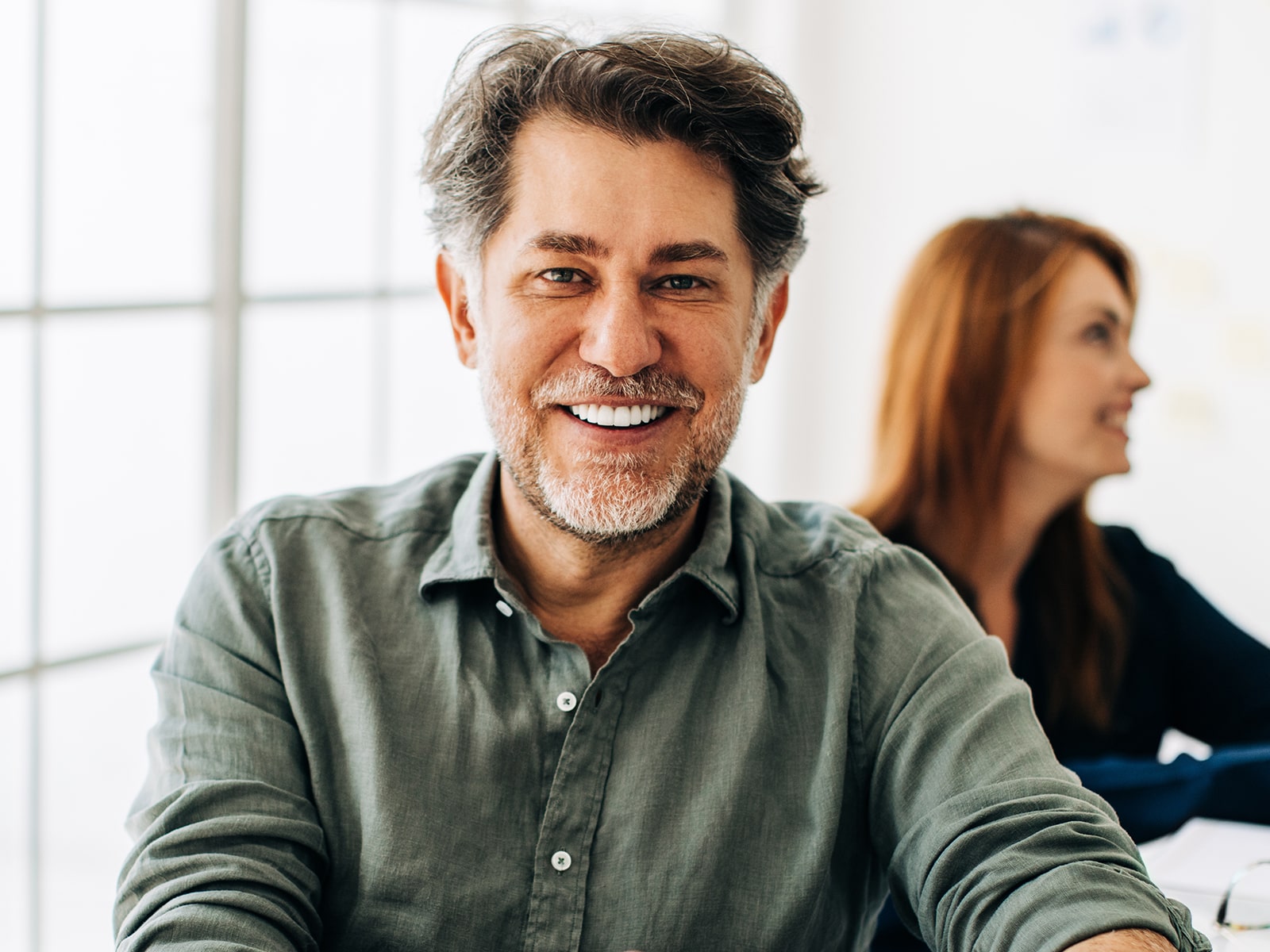Office man smiling at desk