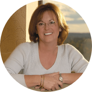 Woman wearing eyeglasses with sunlight streaming in.
