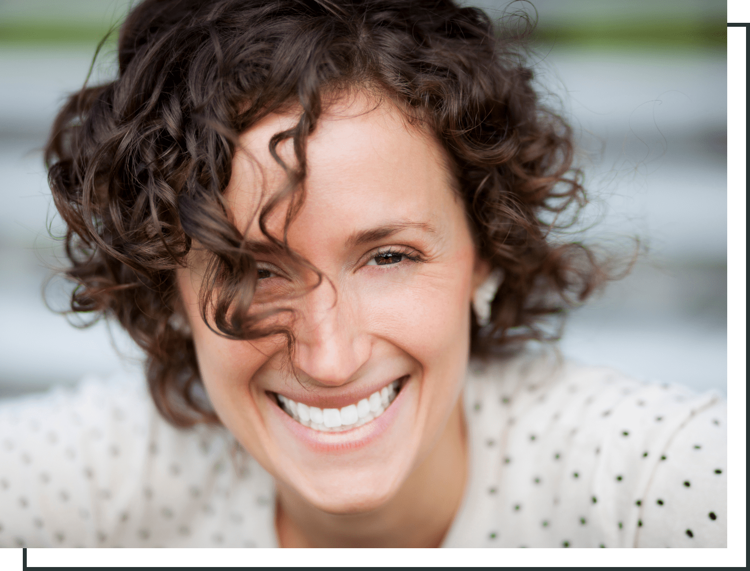 adult woman smiling with teeth